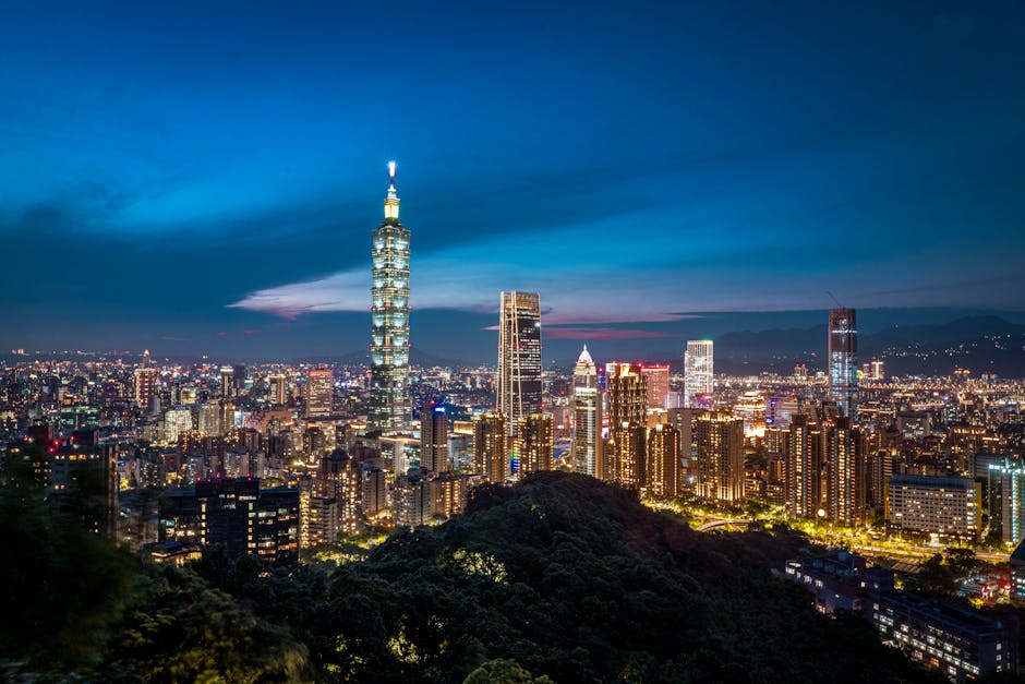 Dazzling view of Taipei skyline featuring the iconic Taipei 101 illuminated against the night sky.