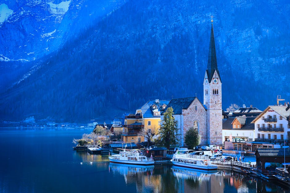 Picturesque Hallstatt village with iconic church by the lake during day.